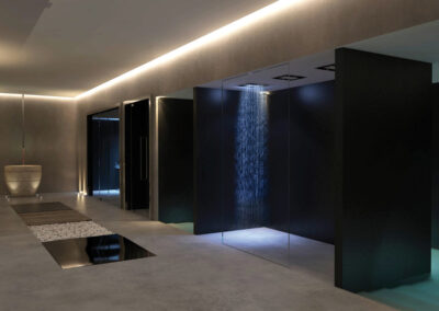 Spa with LED light strip and low lit communal area